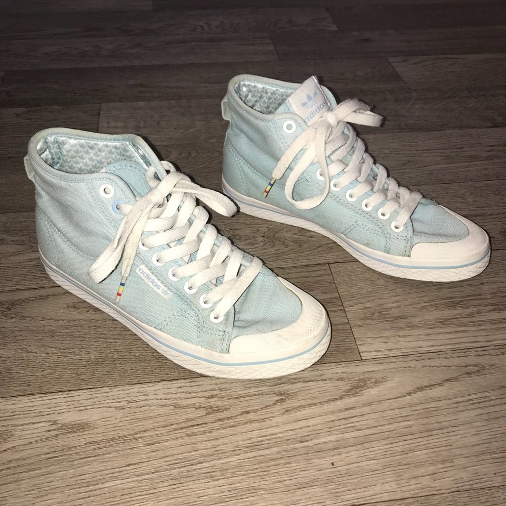 Baby blue high top Adidas sneakers
